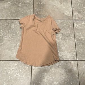 Tan shirt, small plane